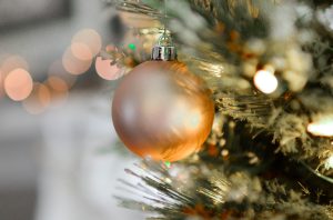 gold christmas ball hanging on christmas tree